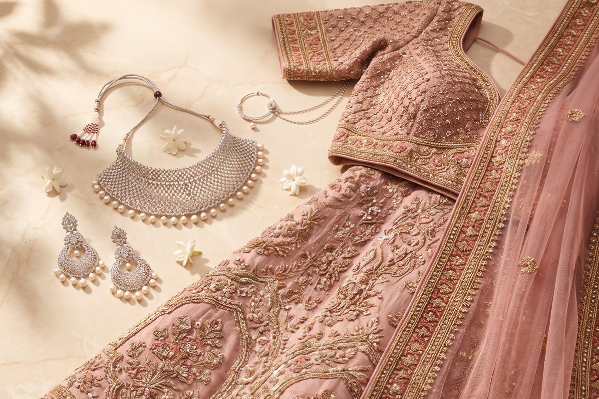 Illustrative bridal moodboard with kasavu silk, gold earrings and jasmine